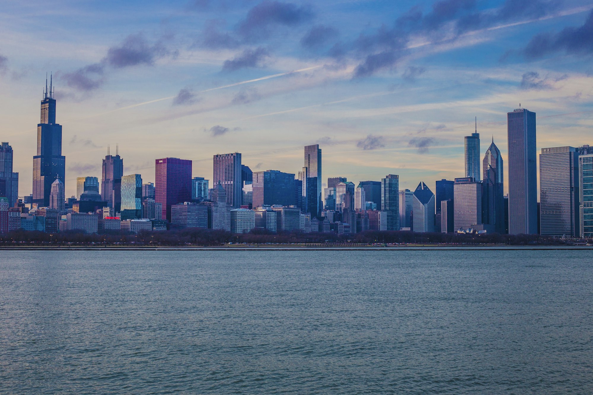 Chicago skyline across Lake Michigan in the evening